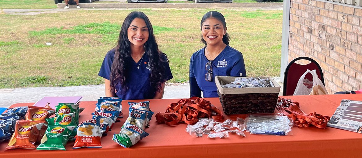 Two BSN students at a community event.