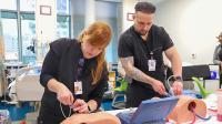 Emergency/Trauma Care NP students at the sim lab