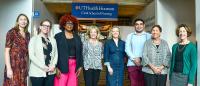 Pictured: Dr. Maja Djukic, Dr. Ansley Stanfill, Dr. Veronica Brady, Dr. Allison Edwards, Dr. Diane Santa Maria, Dr. Higinio Fernandez-Sanchez, Dr. Susan Ruppert, and Dr. Janet Van Cleave. The banner has Cizik School of Nursing logo.