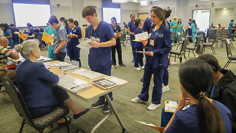 UTHealth Houston students take on the roles of financially struggling families in a poverty simulation.