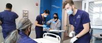 Students interact with a standardized patient portraying the character John Miller in a vaccine hesitancy simulation that grew out an unfolding case study that will be included in the AACN Essentials Toolkit.