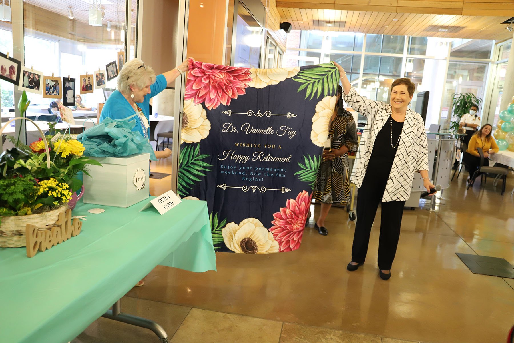 Associate Dean for Graduate Studies Dr. Susan Ruppert (right) presents Dr. Fay with a retirement gift.