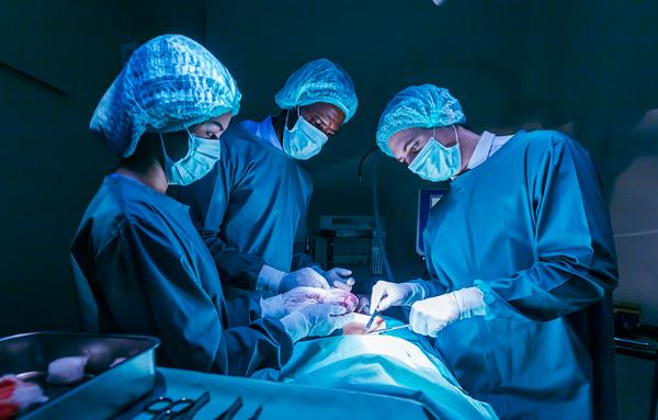 Surgical team performing an operation. Courtesy Getty Images.