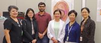 Dr. Chao Hsing Yeh (in white coat) poses with her research team