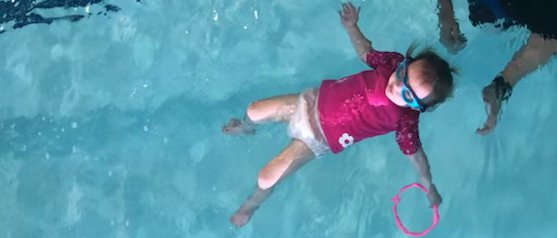 Kimber McCrackin floating on her back when she first started adaptive swim lessons at 2 years old (Photo Courtesy of: Heather McCrackin)