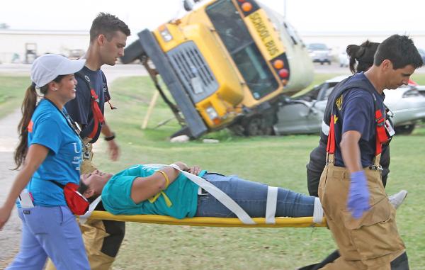 ENP student and firefighters at a mass casualty drill
