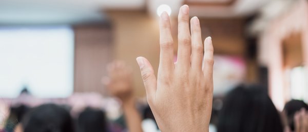 Stock photo of raised hand, courtesy Getty Images.