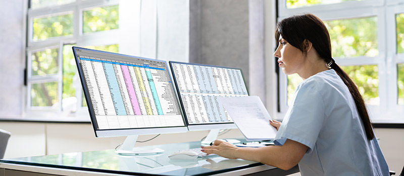 Stock image of nurse with two computer screens, courtesy Getty Images.