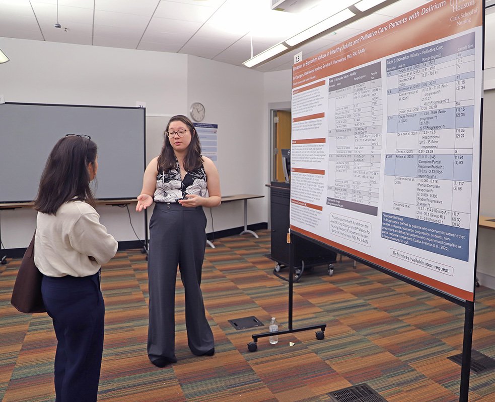 BSN graduate Mari Spurgers discusses her poster.