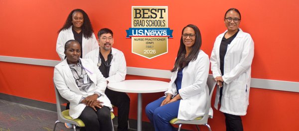 A group of family nurse practitioner students before class. The badge on the photo reads 