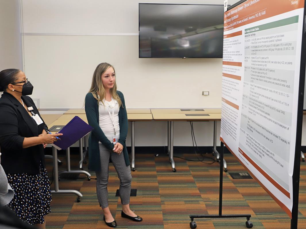 Meagan Chavarria discusses her poster. Meagan Chavarria discusses her poster.