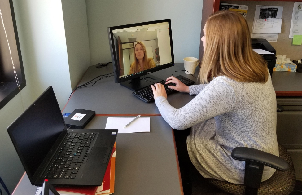 Nurse Practitioner Angela Rutherford and Assistant Nurse Manager Karen Hayes (on the screen) demonstrate a telehealth visit at UT Health Services.