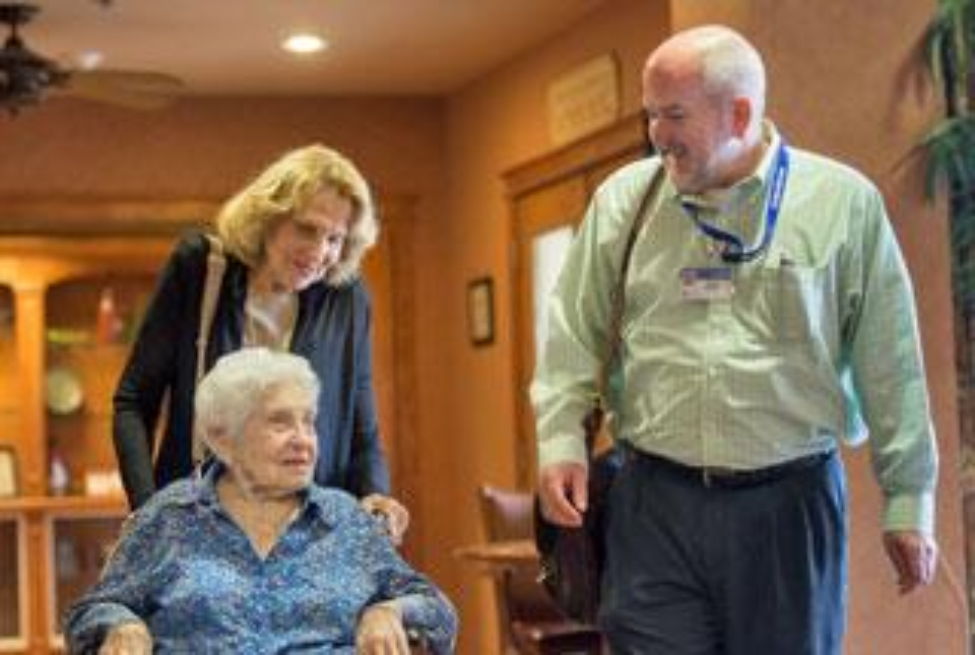 Volunteer ombudsman Jackie Friedman and program manager Greg Shelley check on “Etta,” resident of a local long-term facility.