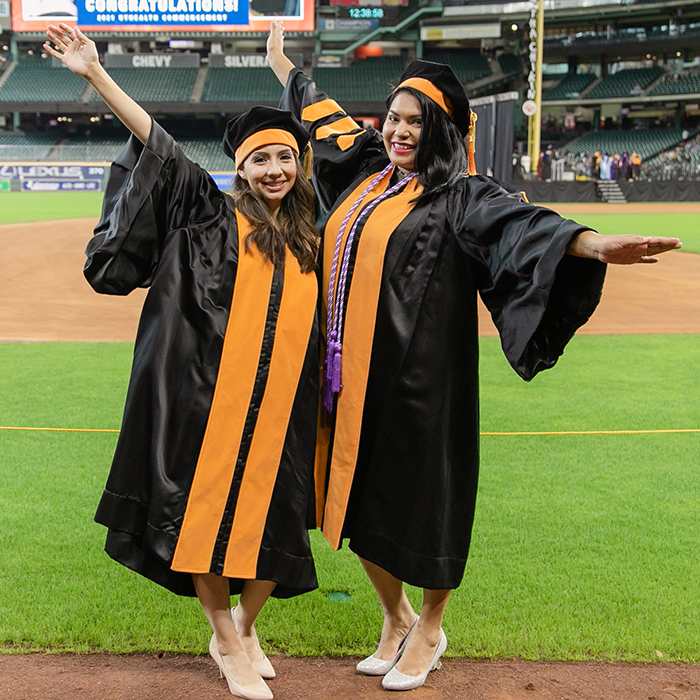 Two doctor of nursing practice graduates at commencement.